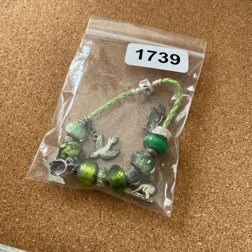 Green child charm bracelet koala